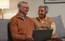 Man and Woman Sitting on Sofa
